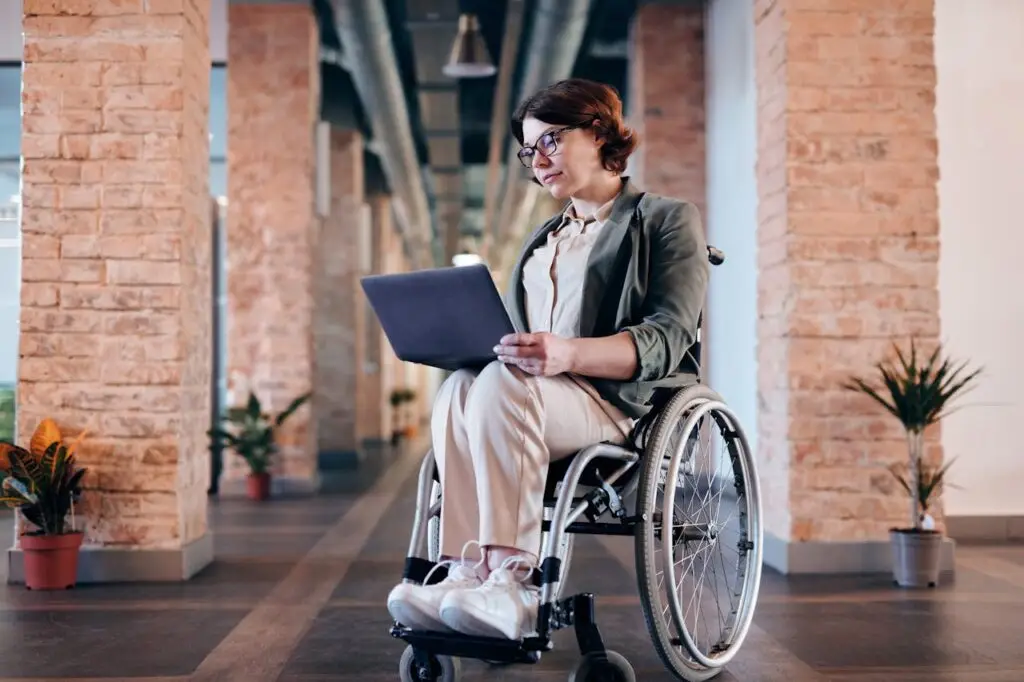 A woman in a wheelchair speaking with a social worker in Italy